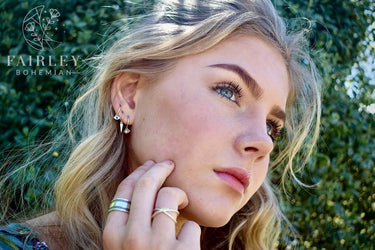 set of 3 huggie hoops bohemian earrings model wearing earrings and rings